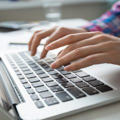 cropped-view-hands-typing-laptop (1)-68304784